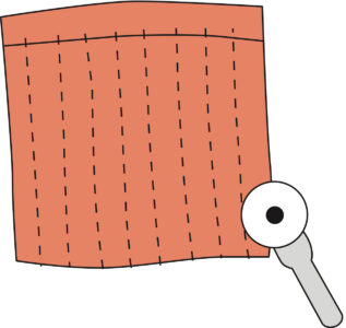 illustration showing a rotary cutter making partial cuts across separated t-shirt body